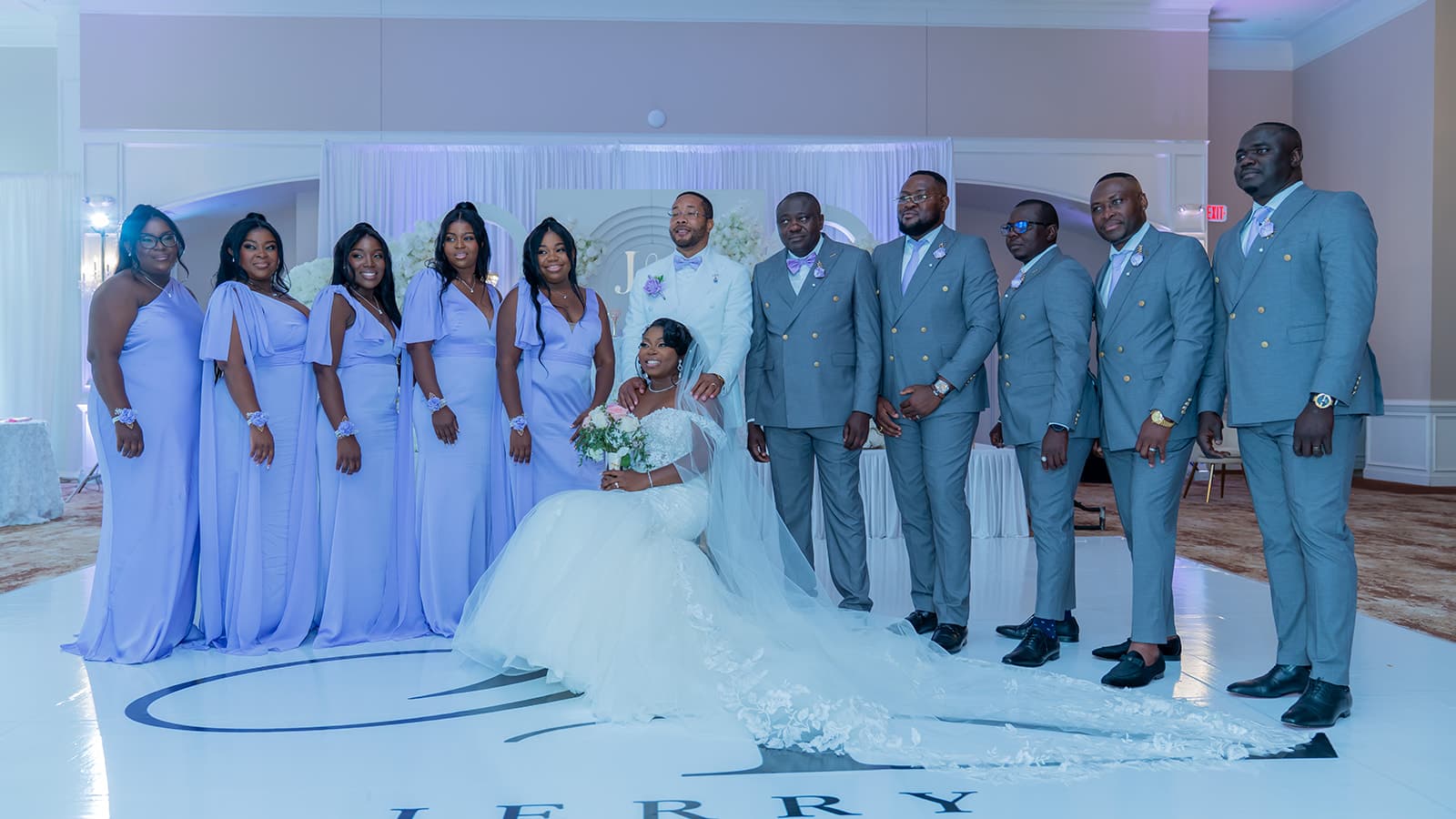 Wedding party gathered with the couple for a formal portrait